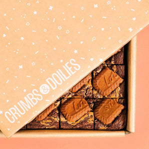Crumbs & Doilies Biscoff Brownie with Lotus biscuit topping in branded packaging, ready to enjoy or gift.